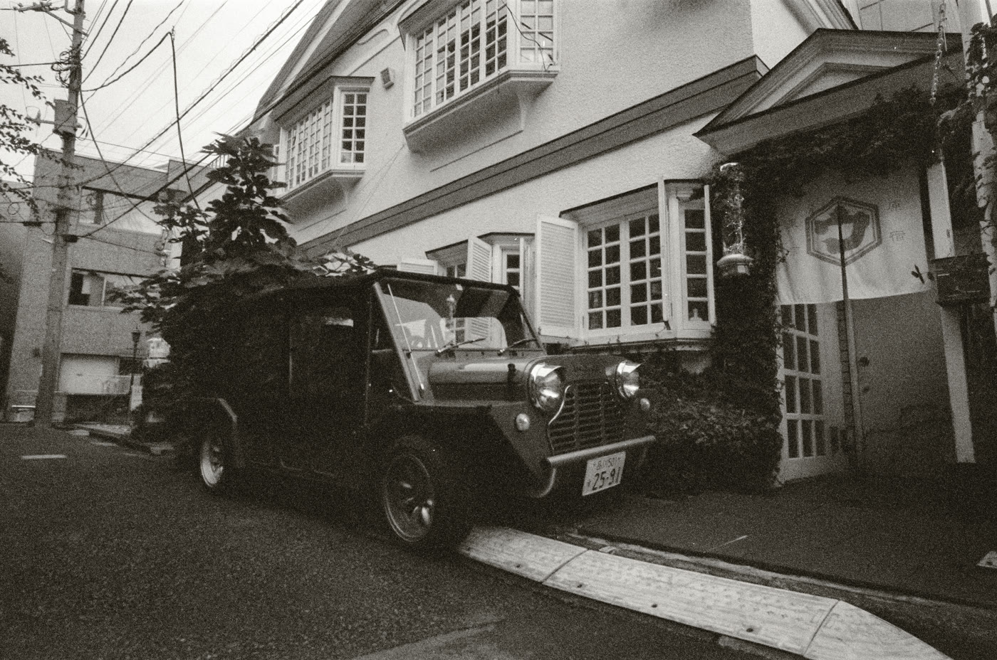 Mini Moke parked in a Tokyo side street · photograph by Jeff Smith